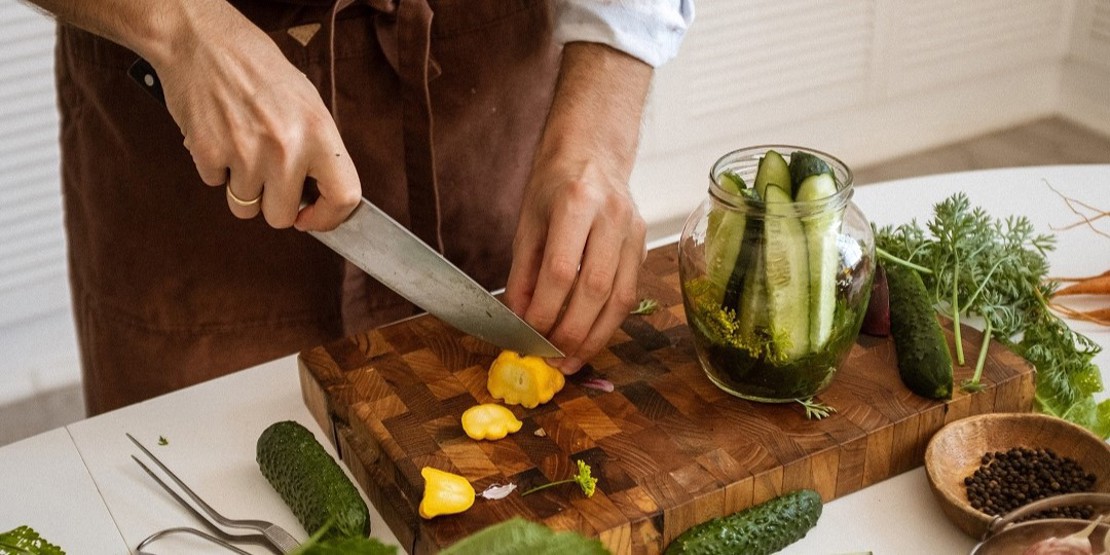 Vegetables being chopped on a chopping board