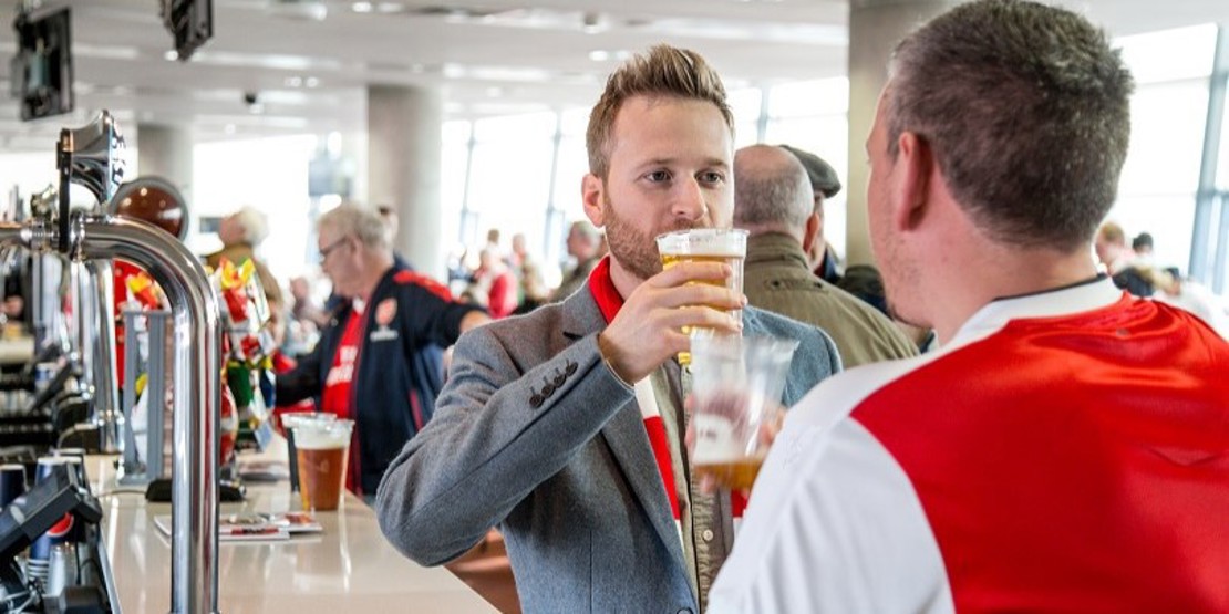 Supporter enjoying a beer on Club Level